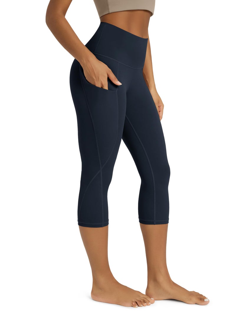 ODODOS Women's High Waisted Yoga Capris with Pockets,Tummy Control Non See Through Workout Sports Running Capri Leggings, Deep Navy,X-Large - Image 1